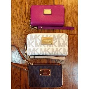 3 Michael Kors wristlets.